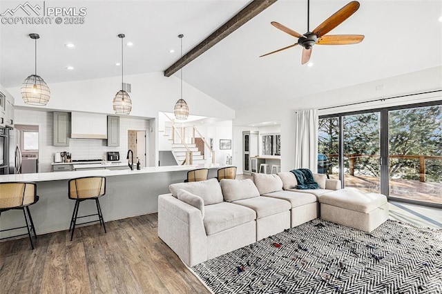 17870 New London Rd, Monument, CO 80132 - living area with stairway, wood finished floors, a ceiling fan, beamed ceiling, and high vaulted ceiling
