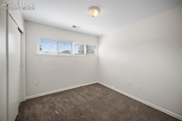 4703 N Weber St, Colorado Springs, CO 80907 - unfurnished bedroom featuring dark colored carpet and a closet
