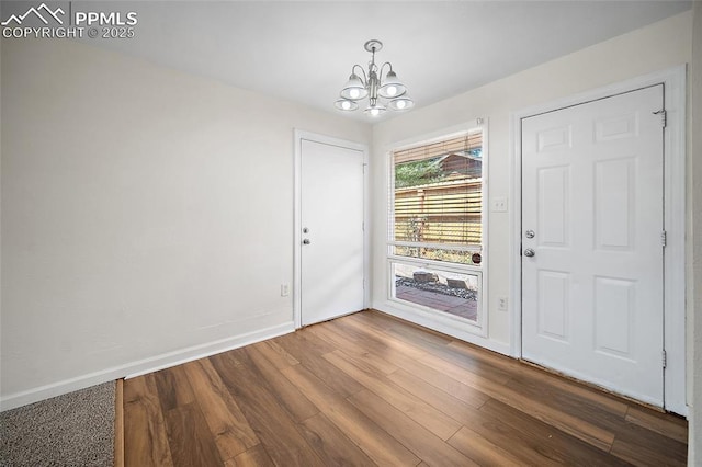 4703 N Weber St, Colorado Springs, CO 80907 - foyer featuring a chandelier and wood finished floors