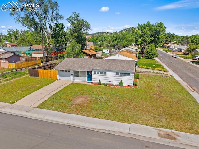 4703 N Weber St, Colorado Springs, CO 80907 - view of front of property with concrete driveway, a residential view, and a garage