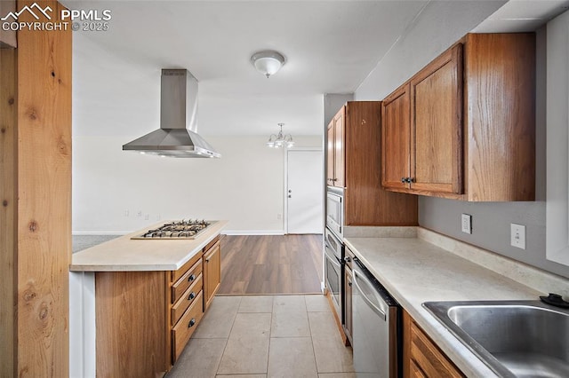 4703 N Weber St, Colorado Springs, CO 80907 - kitchen featuring ventilation hood, stainless steel appliances, brown cabinets, light countertops, and light tile patterned floors