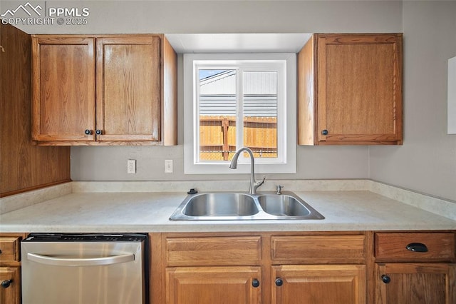 4703 N Weber St, Colorado Springs, CO 80907 - kitchen featuring dishwasher, light countertops, and brown cabinets