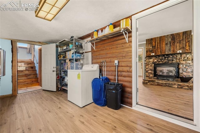 2925 M Path, Cotopaxi, CO 81223 - basement featuring washer / dryer, wood finished floors, stairs, and a fireplace
