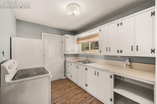 2925 M Path, Cotopaxi, CO 81223 - kitchen featuring white appliances, light wood-style floors, white cabinets, and light countertops