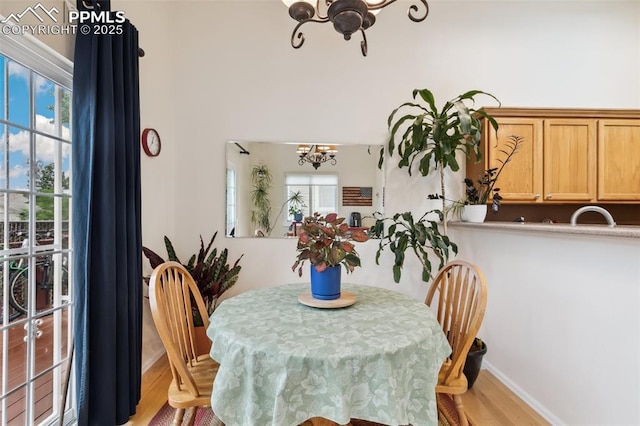 968 Samuel Pt, Colorado Springs, CO 80906 - dining space featuring a chandelier and light wood-type flooring
