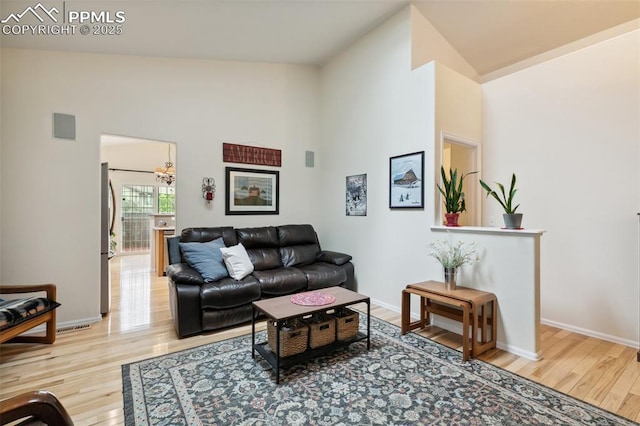 968 Samuel Pt, Colorado Springs, CO 80906 - living room featuring wood finished floors and high vaulted ceiling