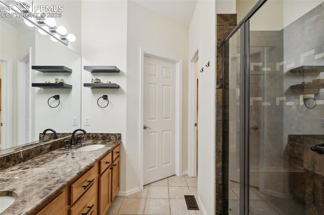968 Samuel Pt, Colorado Springs, CO 80906 - full bath featuring double vanity, a stall shower, and tile patterned flooring