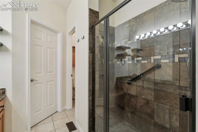 968 Samuel Pt, Colorado Springs, CO 80906 - full bath featuring vanity, a stall shower, and tile patterned flooring