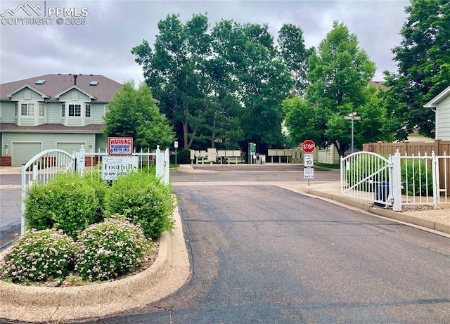 968 Samuel Pt, Colorado Springs, CO 80906 - view of asphalt road featuring traffic signs and curbs