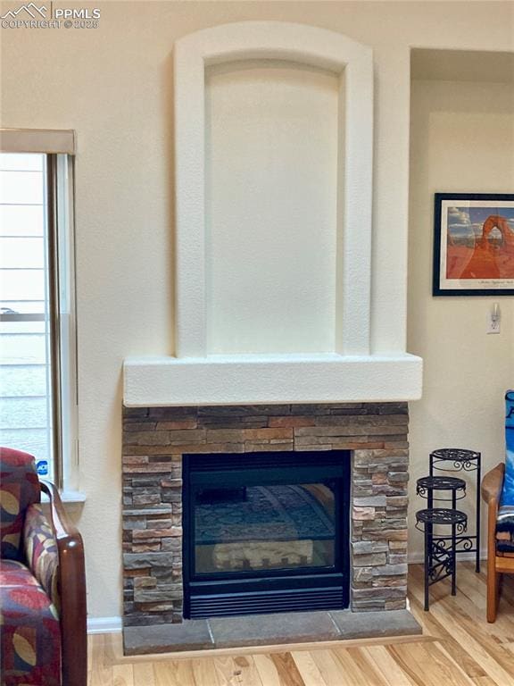 968 Samuel Pt, Colorado Springs, CO 80906 - detailed view of a stone fireplace and wood finished floors