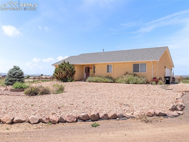 1205 N Picketwire Ln, Pueblo West, CO 81007 - ranch-style home with an attached garage