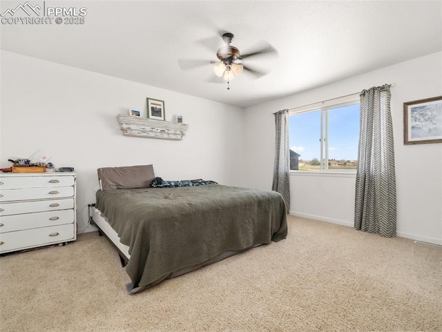 1205 N Picketwire Ln, Pueblo West, CO 81007 - bedroom featuring light carpet and a ceiling fan