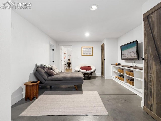 1205 N Picketwire Ln, Pueblo West, CO 81007 - living area featuring finished concrete flooring and recessed lighting
