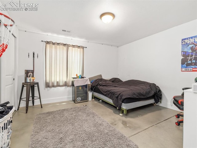 1205 N Picketwire Ln, Pueblo West, CO 81007 - bedroom featuring finished concrete floors and baseboards