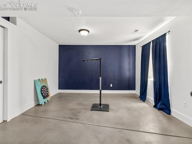 1205 N Picketwire Ln, Pueblo West, CO 81007 - spare room with concrete floors and a smoke detector