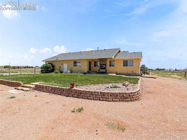 1205 N Picketwire Ln, Pueblo West, CO 81007 - rear view of property with a patio, stucco siding, and a yard