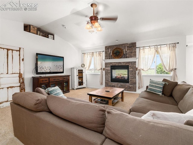 1205 N Picketwire Ln, Pueblo West, CO 81007 - living area featuring carpet, plenty of natural light, a ceiling fan, a fireplace, and lofted ceiling