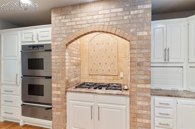 155 Grayson Ct, Colorado Springs, CO 80906 - kitchen featuring a warming drawer, appliances with stainless steel finishes, and white cabinetry