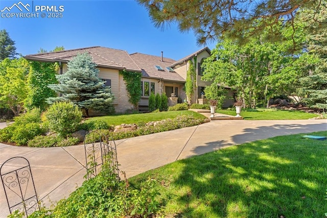 155 Grayson Ct, Colorado Springs, CO 80906 - view of front of property featuring a front yard and a tile roof