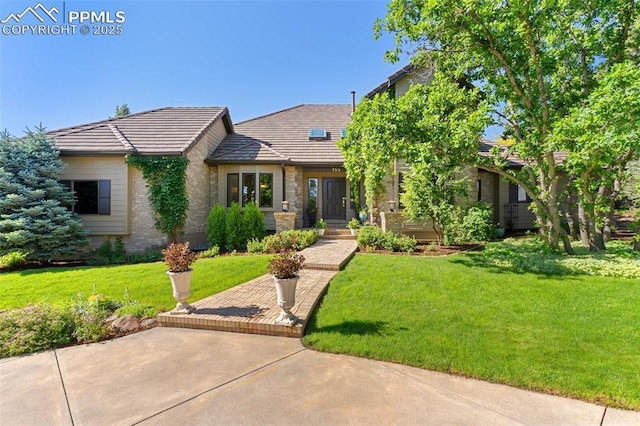 155 Grayson Ct, Colorado Springs, CO 80906 - view of front of home featuring brick siding and a front lawn