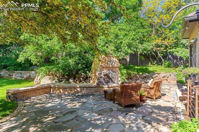 155 Grayson Ct, Colorado Springs, CO 80906 - view of patio with an outdoor stone fireplace