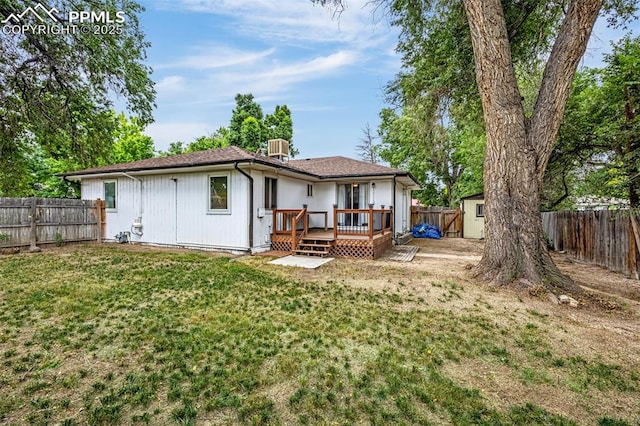 601 N 15th St, Canon City, CO 81212 - back of house with a deck, a fenced backyard, and a storage unit
