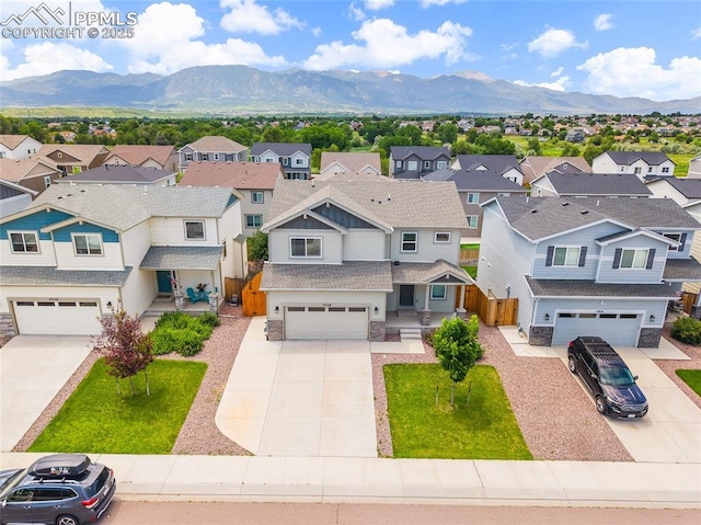 4928 Wolf Moon Dr, Colorado Springs, CO 80911 - aerial view of residential area with a mountainous background