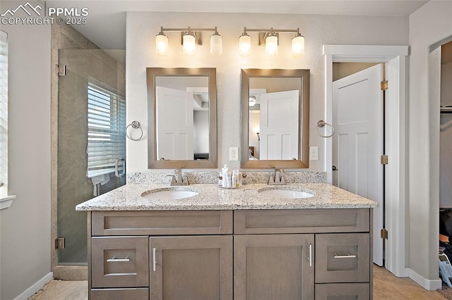 4928 Wolf Moon Dr, Colorado Springs, CO 80911 - full bathroom featuring a stall shower and double vanity