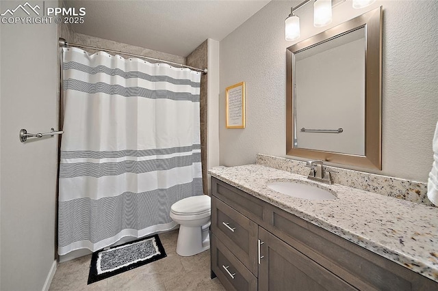 4928 Wolf Moon Dr, Colorado Springs, CO 80911 - full bathroom with vanity, curtained shower, and a textured wall