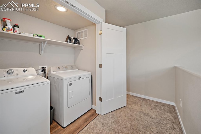 4928 Wolf Moon Dr, Colorado Springs, CO 80911 - laundry area featuring washer and clothes dryer and light colored carpet