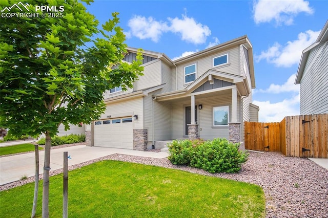 4928 Wolf Moon Dr, Colorado Springs, CO 80911 - view of front of property featuring stone siding, board and batten siding, driveway, and a gate