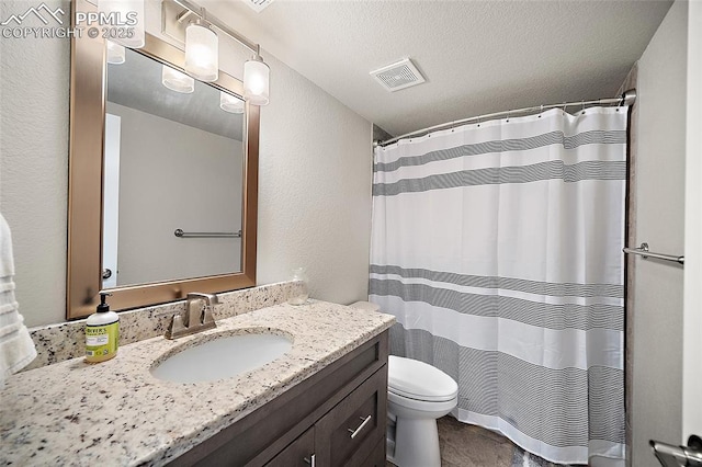 4928 Wolf Moon Dr, Colorado Springs, CO 80911 - bathroom featuring vanity, a textured wall, curtained shower, and a textured ceiling