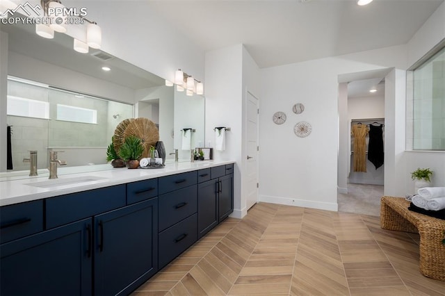 17226 Alsike Clover Ct, Monument, CO 80132 - bathroom featuring double vanity, recessed lighting, a shower, and a closet