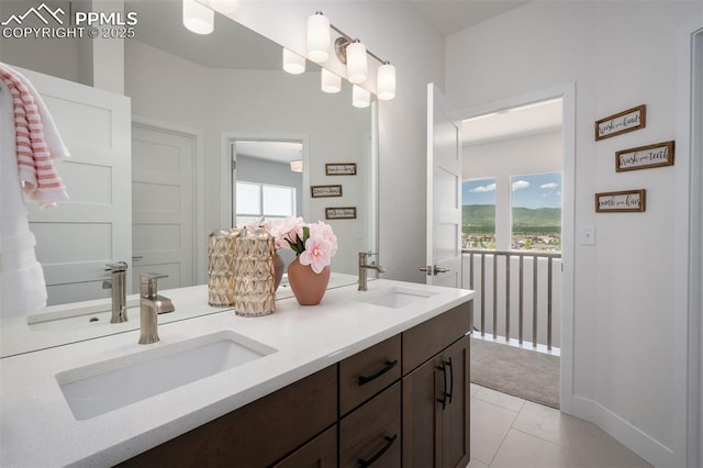 17226 Alsike Clover Ct, Monument, CO 80132 - bathroom with double vanity, healthy amount of natural light, and tile patterned floors