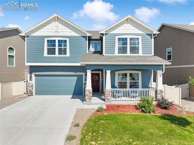 4631 Zircon Dr, Colorado Springs, CO 80938 - craftsman-style home with driveway, a porch, a garage, roof with shingles, and stone siding