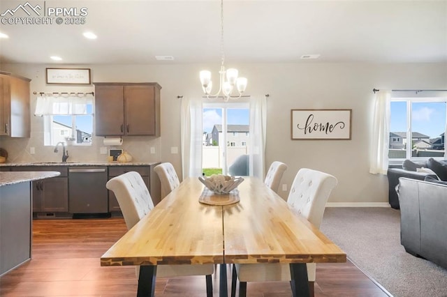 4631 Zircon Dr, Colorado Springs, CO 80938 - dining room with a chandelier, plenty of natural light, wood finished floors, and recessed lighting