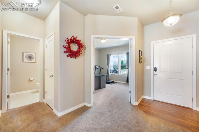 4631 Zircon Dr, Colorado Springs, CO 80938 - entrance foyer with carpet floors and baseboards