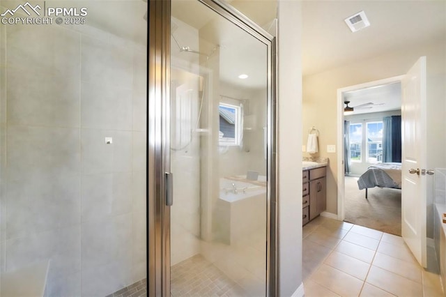 4631 Zircon Dr, Colorado Springs, CO 80938 - full bath featuring a shower stall, vanity, tile patterned floors, and ensuite bathroom