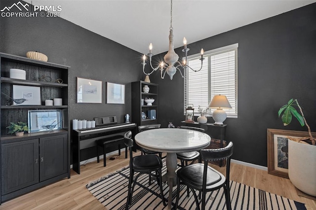 6131 Vickie Ln, Colorado Springs, CO 80923 - dining area featuring a chandelier and wood finished floors