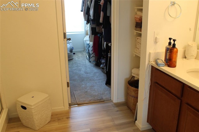 6131 Vickie Ln, Colorado Springs, CO 80923 - full bathroom with vanity, wood finished floors, and a shower