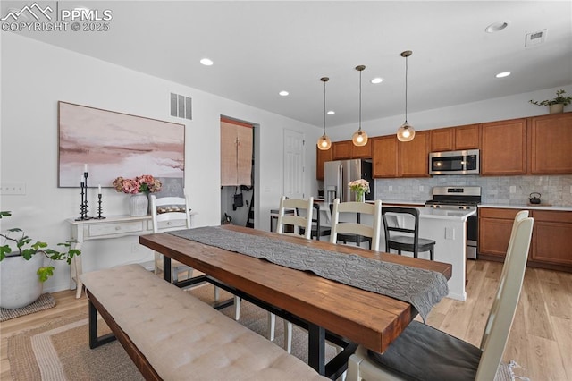 6131 Vickie Ln, Colorado Springs, CO 80923 - dining room with light wood-style floors and recessed lighting