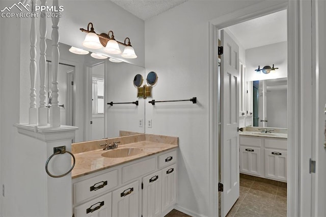3710 Saddle Rock Rd, Colorado Springs, CO 80918 - full bath with two vanities and a textured ceiling