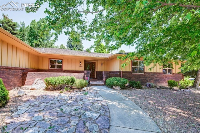 3710 Saddle Rock Rd, Colorado Springs, CO 80918 - view of front of property featuring brick siding and board and batten siding