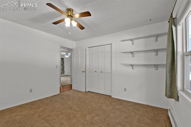 3710 Saddle Rock Rd, Colorado Springs, CO 80918 - unfurnished bedroom with baseboard heating, carpet flooring, a textured ceiling, and ceiling fan