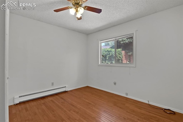 3710 Saddle Rock Rd, Colorado Springs, CO 80918 - unfurnished room featuring a baseboard heating unit, a textured ceiling, wood finished floors, and a ceiling fan