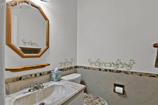 3710 Saddle Rock Rd, Colorado Springs, CO 80918 - half bath with vanity and tile walls