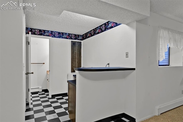 3710 Saddle Rock Rd, Colorado Springs, CO 80918 - bar area with a baseboard heating unit, tile patterned floors, baseboard heating, and a textured ceiling