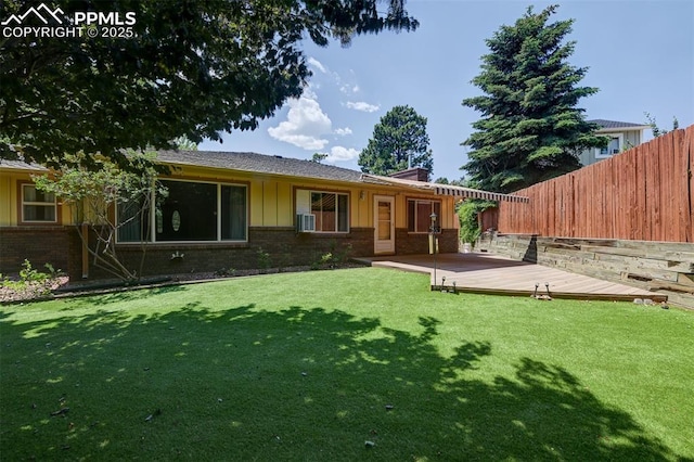 3710 Saddle Rock Rd, Colorado Springs, CO 80918 - rear view of house featuring brick siding, board and batten siding, and a deck