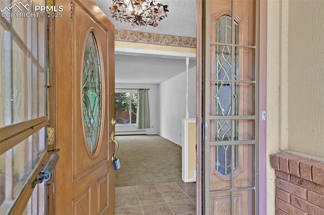 3710 Saddle Rock Rd, Colorado Springs, CO 80918 - carpeted entryway with baseboard heating and a chandelier