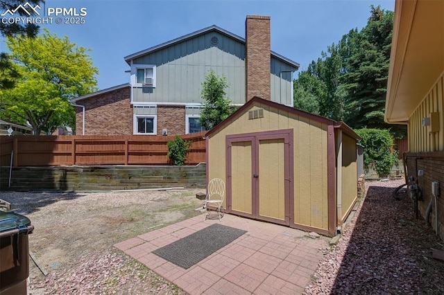 3710 Saddle Rock Rd, Colorado Springs, CO 80918 - fenced backyard with a storage unit and a patio area